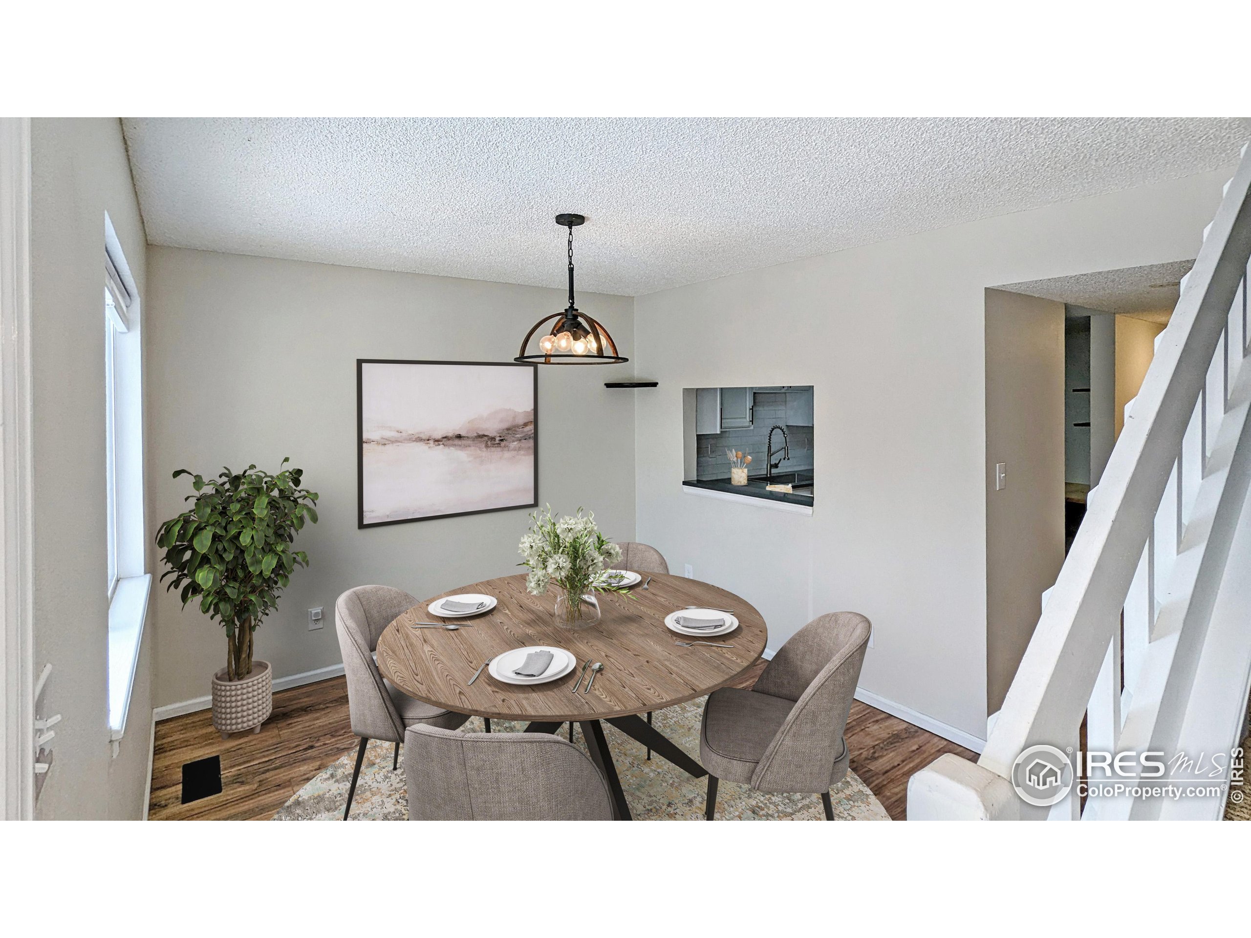 2924 Ross Drive, Unit 19 Fort Collins, CO 80526 - Photo 2 of 28 a kitchen with a table and chairs in it