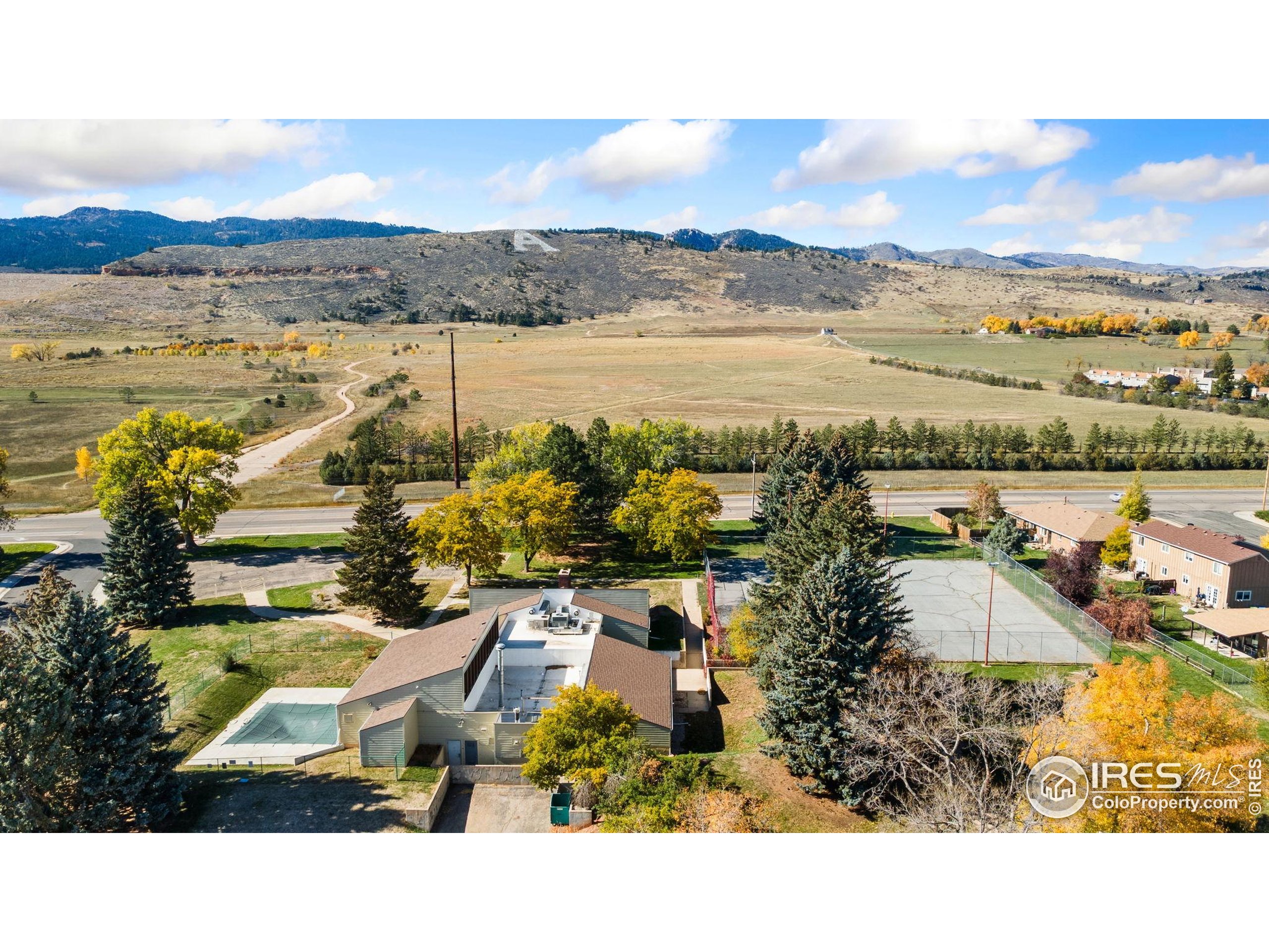 2924 Ross Drive, Unit 19 Fort Collins, CO 80526 - Photo 24 of 28 a view of lake and mountain