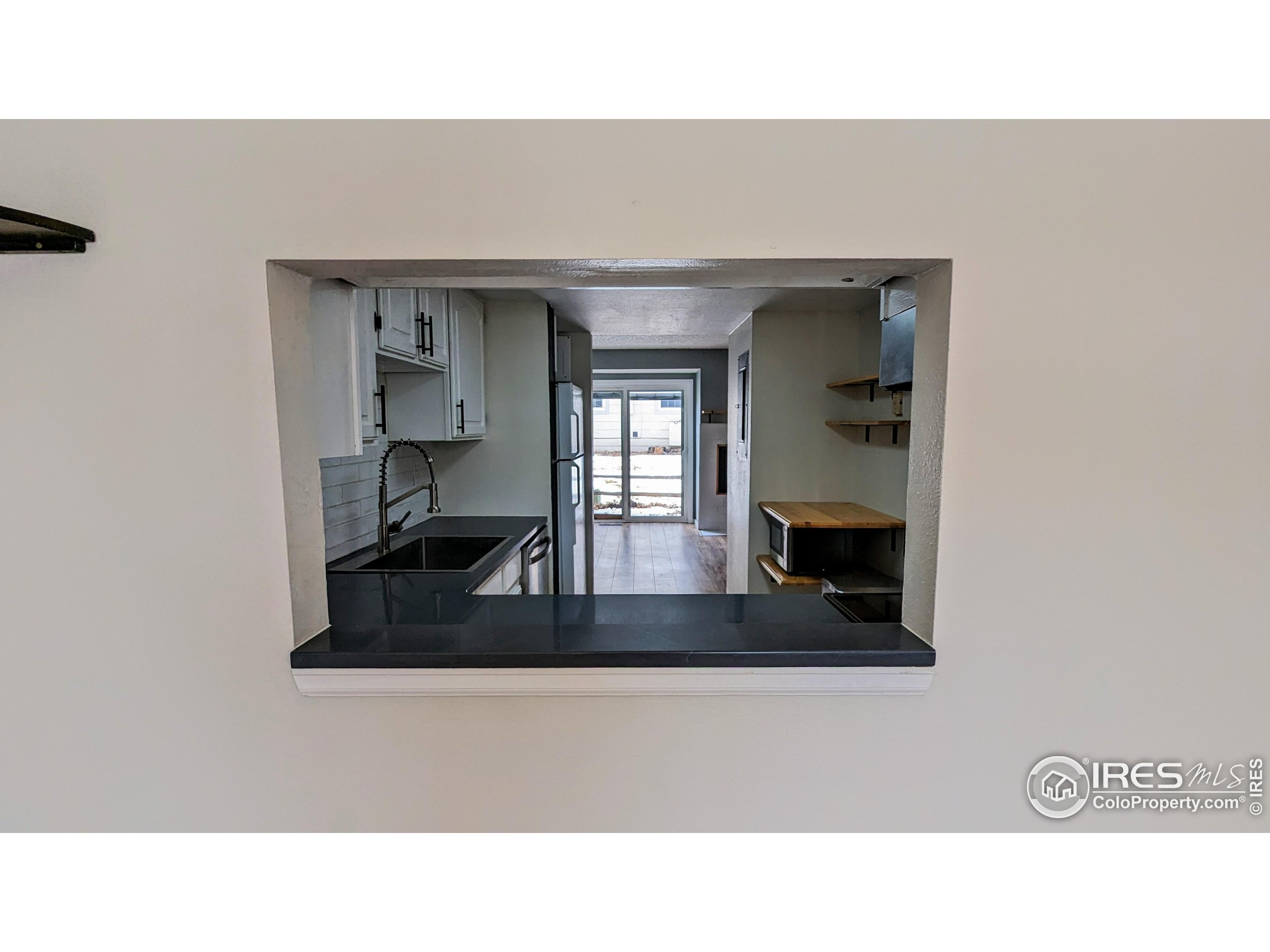 2924 Ross Drive, Unit 19 Fort Collins, CO 80526 - Photo 9 of 28 a black and white photo of a living room