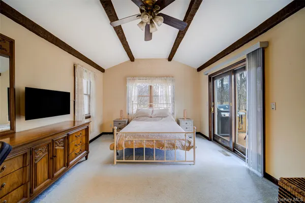 a living room with a flat screen tv and a couch