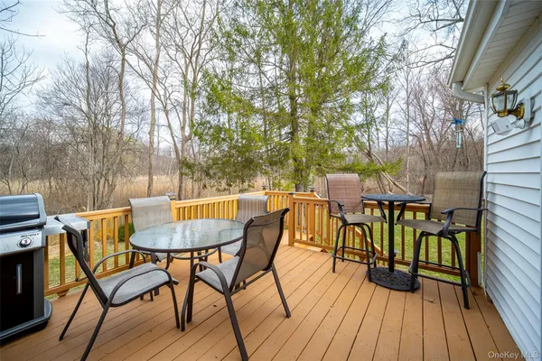 a view of a chairs and table on the deck
