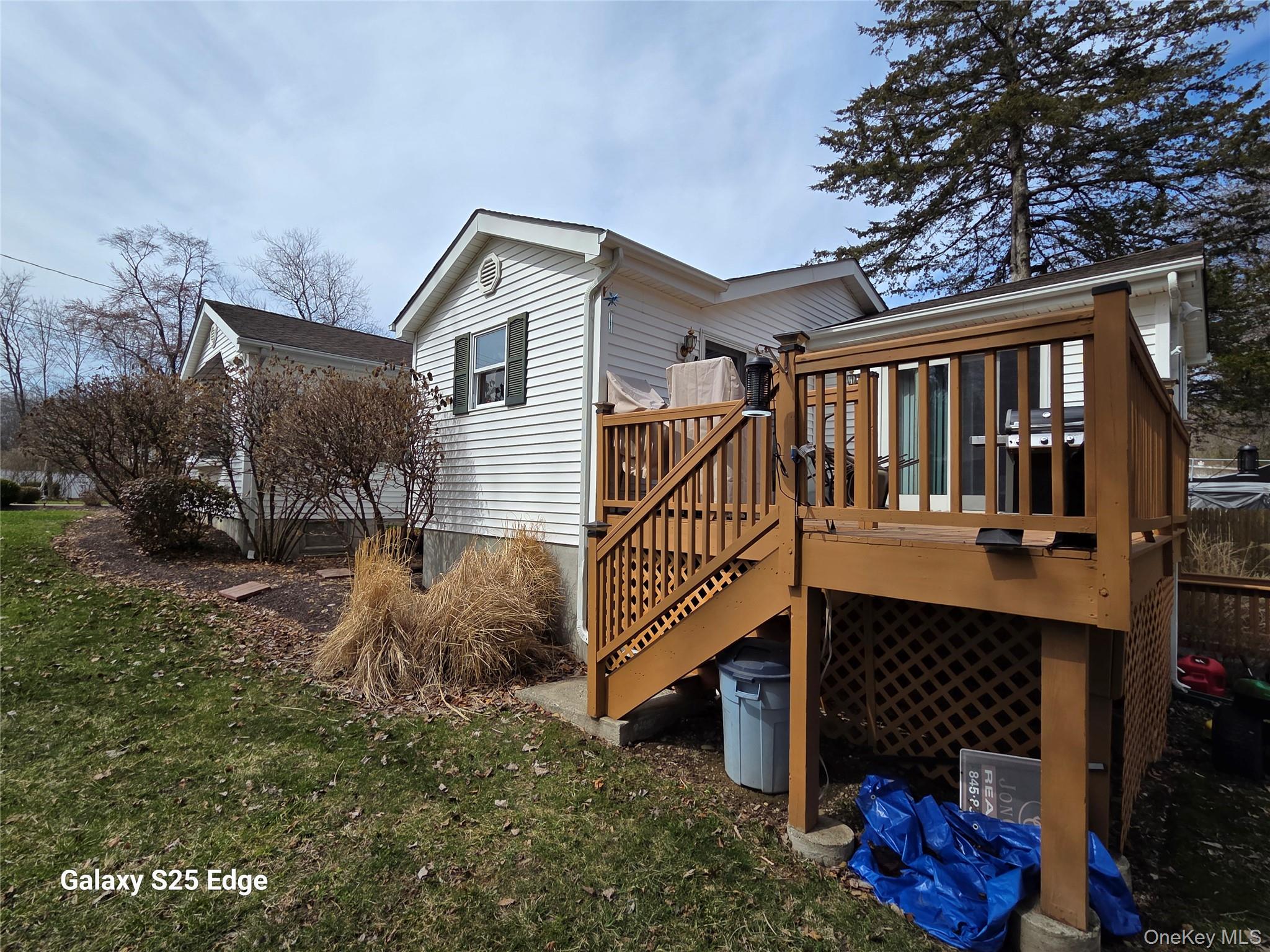 43 Lake Road Hopewell Junction, NY 12533 - Photo 6 of 23 Sliders from Kitchen and Primary Bedroom to the deck.