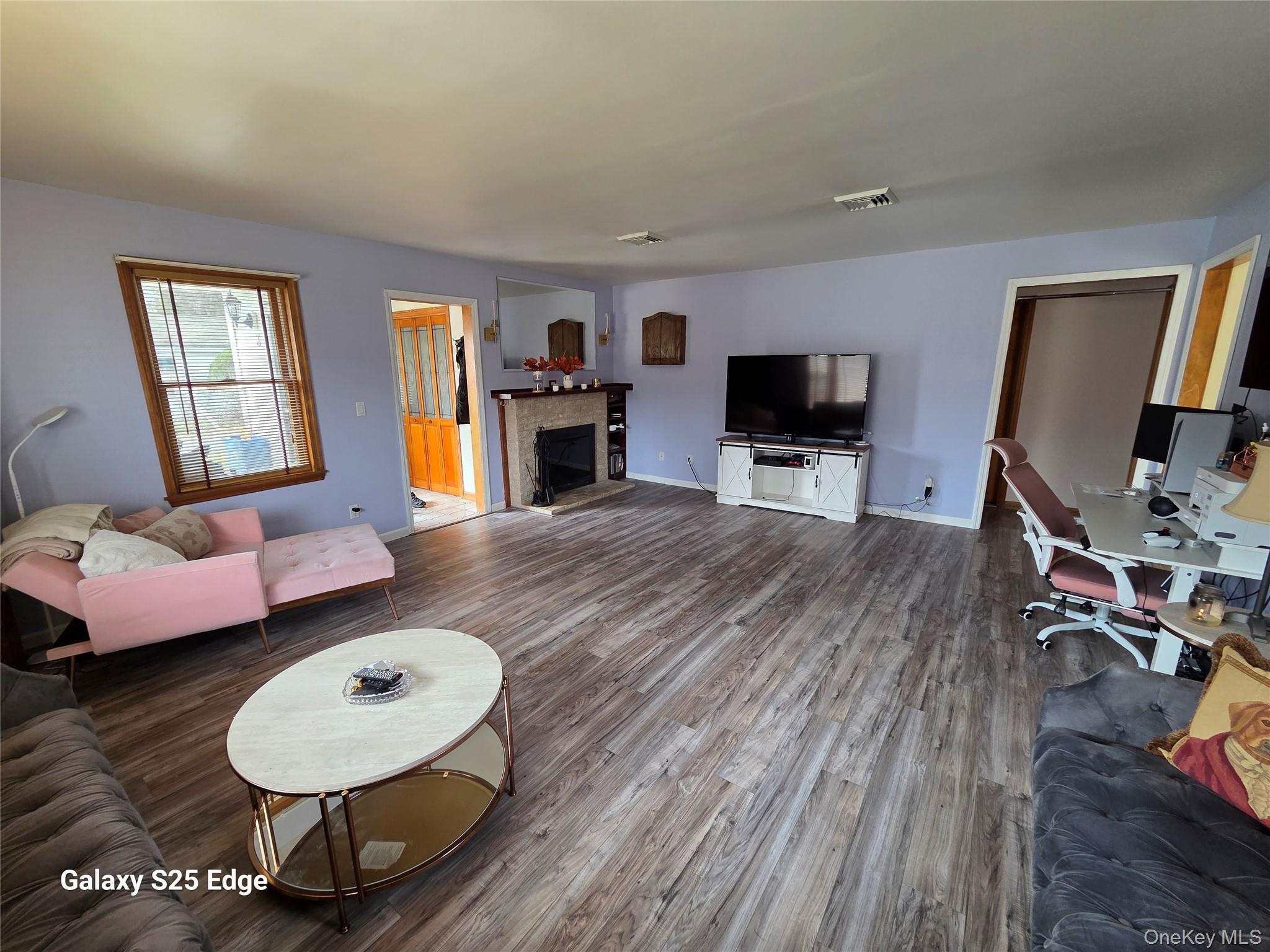 43 Lake Road Hopewell Junction, NY 12533 - Photo 9 of 23 Freshly Painted, New Flooring and Cozy Fireplace.