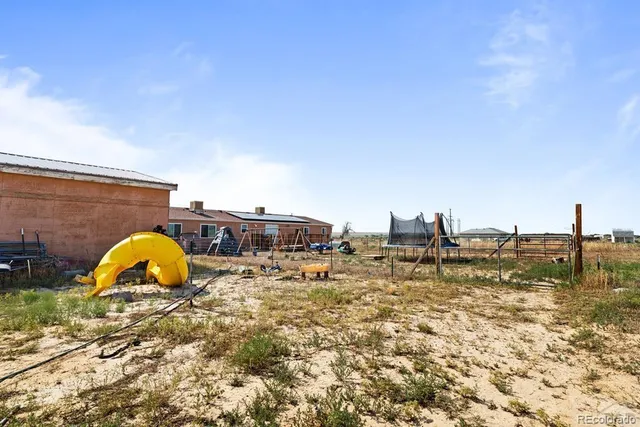 a kitchen with stainless steel appliances granite countertop a refrigerator and stove