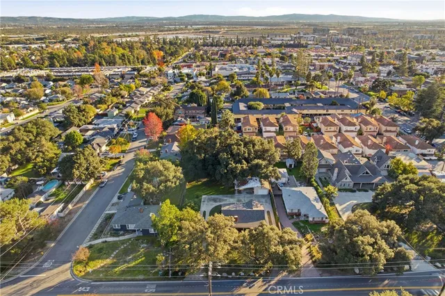 an aerial view of residential houses with outdoor space