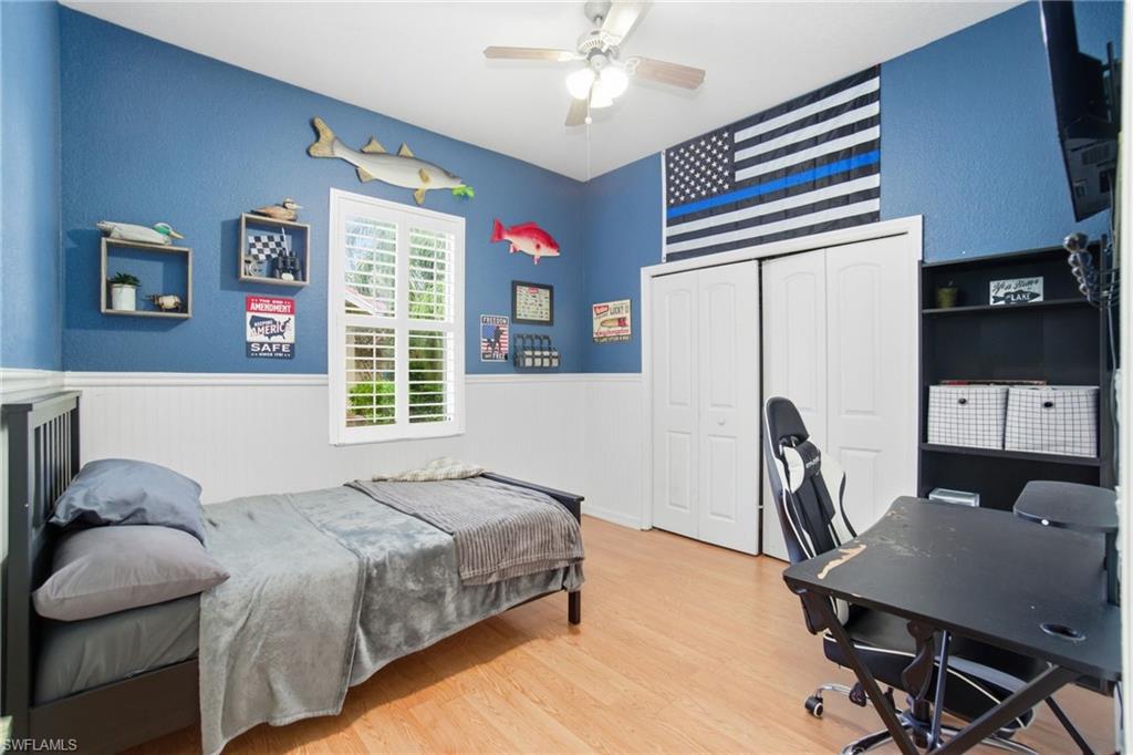 2900 Orange Grove Trail Naples, FL 34120 - Photo 24 of 46 a bedroom with a bed dresser and a window