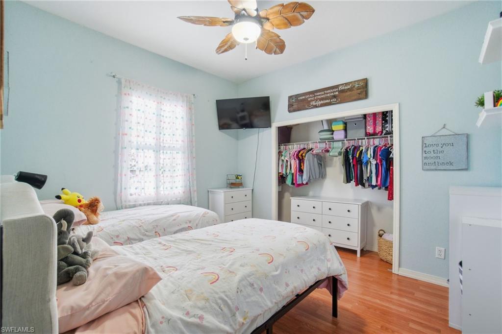 2900 Orange Grove Trail Naples, FL 34120 - Photo 27 of 46 a bedroom with a bed and a window