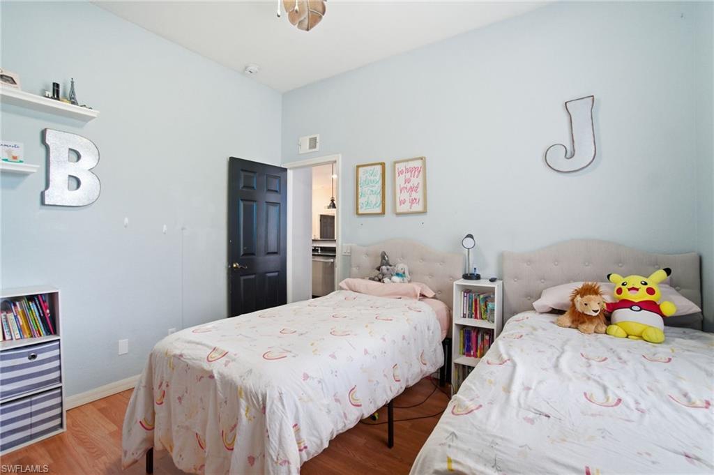 2900 Orange Grove Trail Naples, FL 34120 - Photo 28 of 46 a bedroom with two beds and a bed