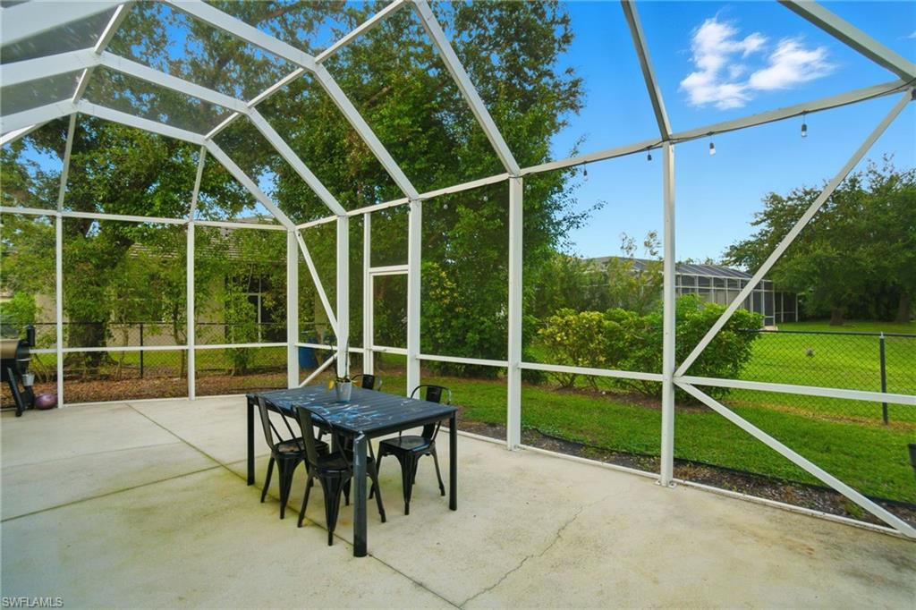 2900 Orange Grove Trail Naples, FL 34120 - Photo 36 of 46 a view of a room with gym equipment and a table