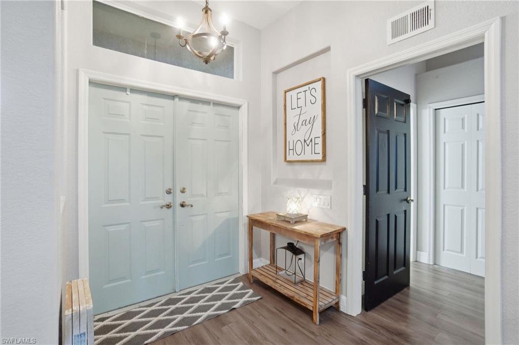 2900 Orange Grove Trail Naples, FL 34120 - Photo 8 of 46 a bedroom with a bed and a window