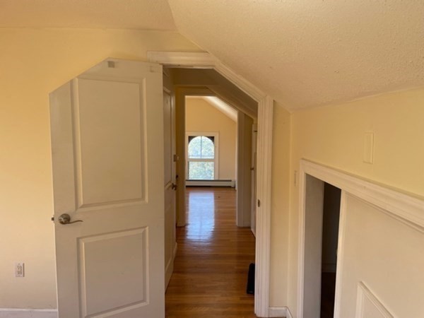 272-2 Nevada Street, Unit 2 Newton, MA 02460 - Photo 23 of 28 a view of a hallway with wooden floor