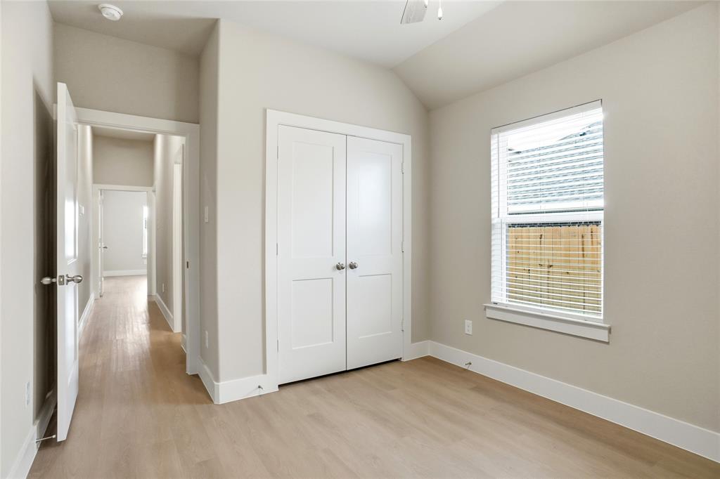 133 Joel Street Springtown, TX 76082 - Photo 10 of 15 a view of an empty room with closet and a window