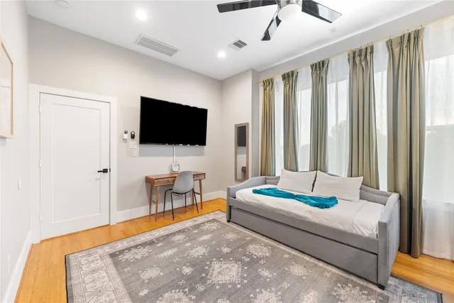 a bathroom with a granite countertop sink and a bathtub