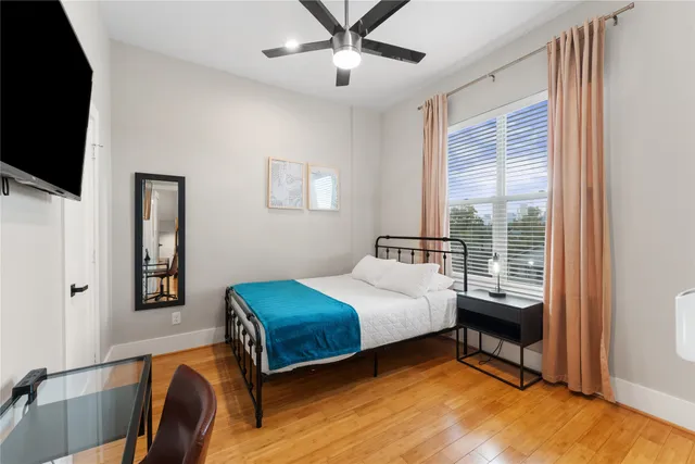 a bathroom with a granite countertop toilet sink and shower