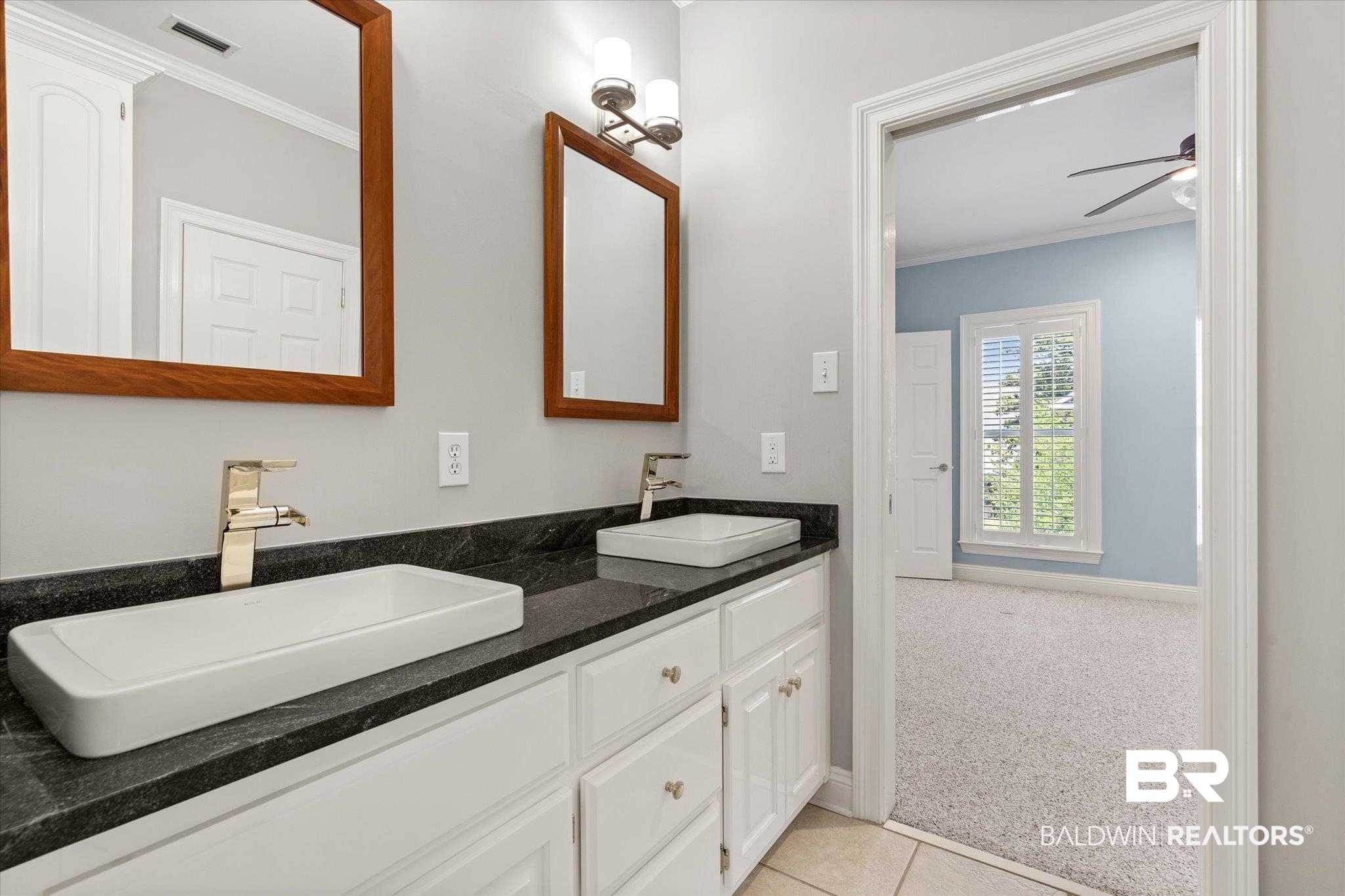 107 Fielding Place Mobile, AL 36608 - Photo 17 of 27 Full bath with ornamental molding, ceiling fan, double vanity, baseboards, and tile patterned flooring