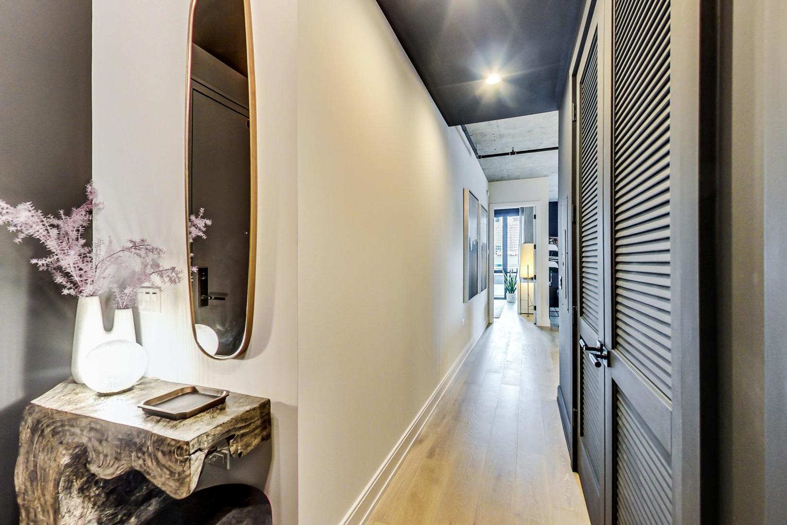 111 South Peoria Street, Unit 309 Chicago, IL 60607 - Photo 6 of 43 a view of entryway and hall with wooden floor