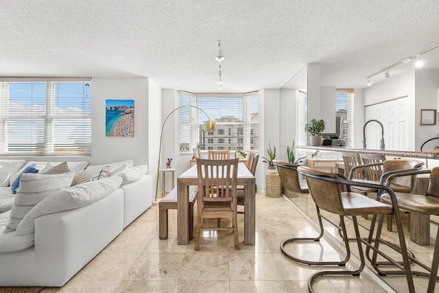 a bedroom with a bed tv and a window