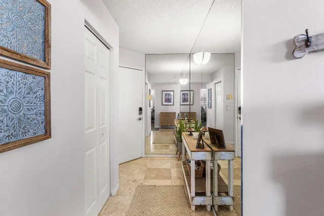 a bathroom with a bathtub shower sink vanity and mirror