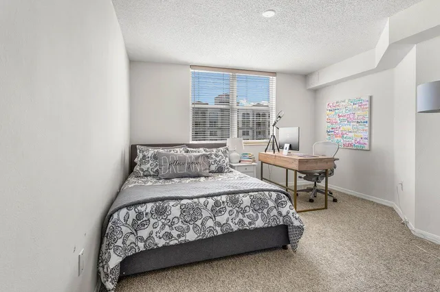 a swimming pool with outdoor seating and yard