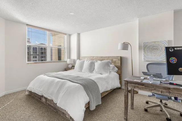 a view of a swimming pool with a yard