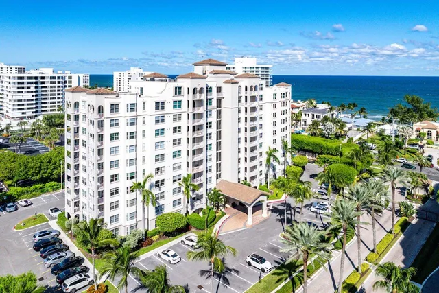 a living room with furniture and dining area