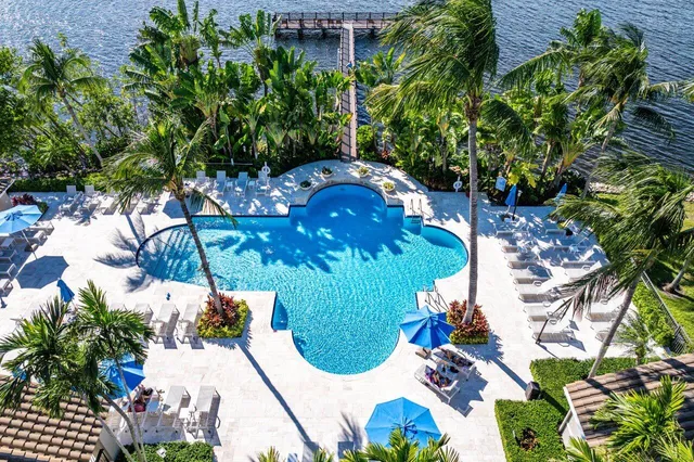 a view of a dining room with furniture and a potted plant