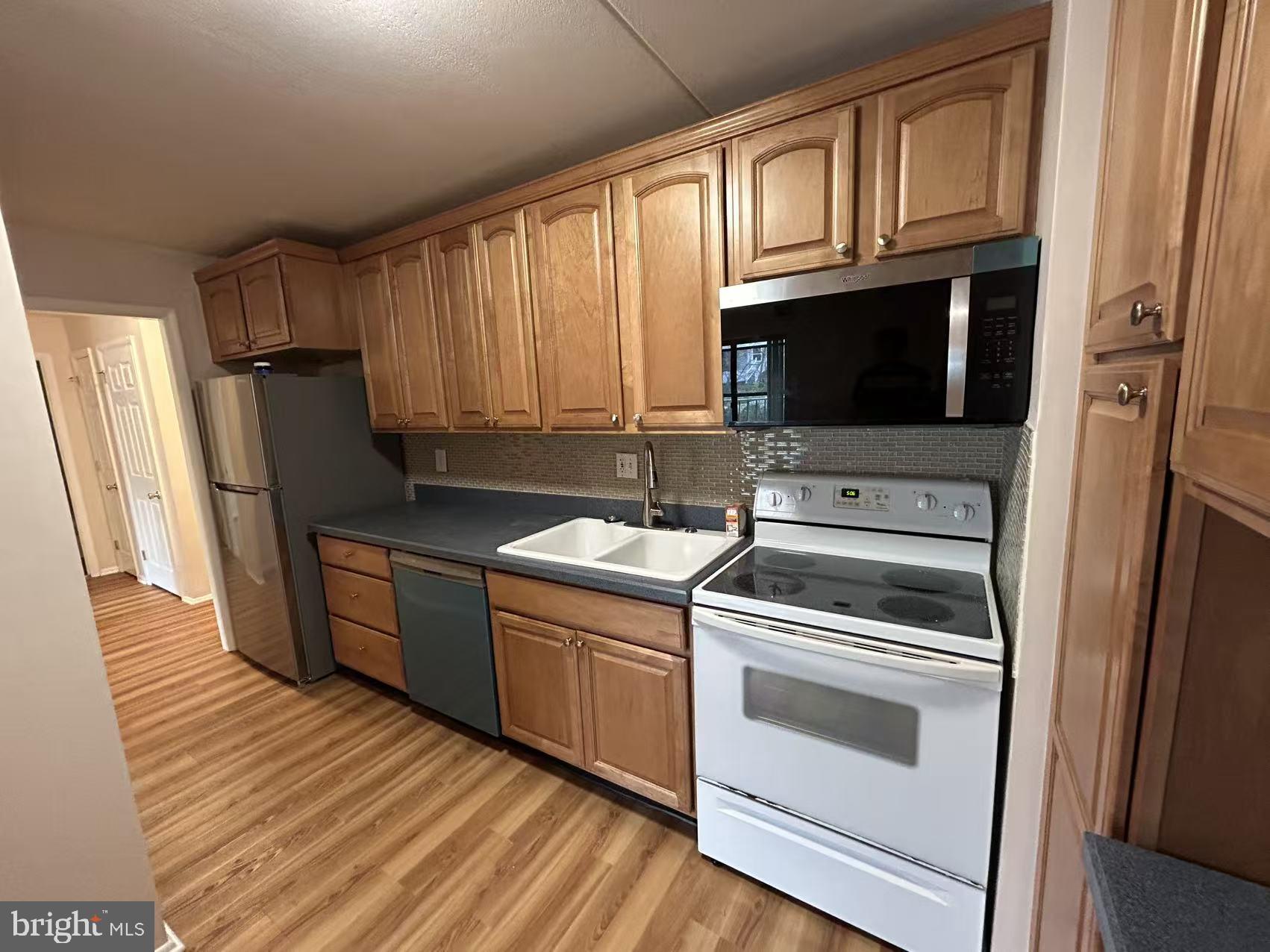 84 Welsh Tract Road Newark, DE 19713 - Photo 5 of 8 Modern kitchen with warm wood tones.