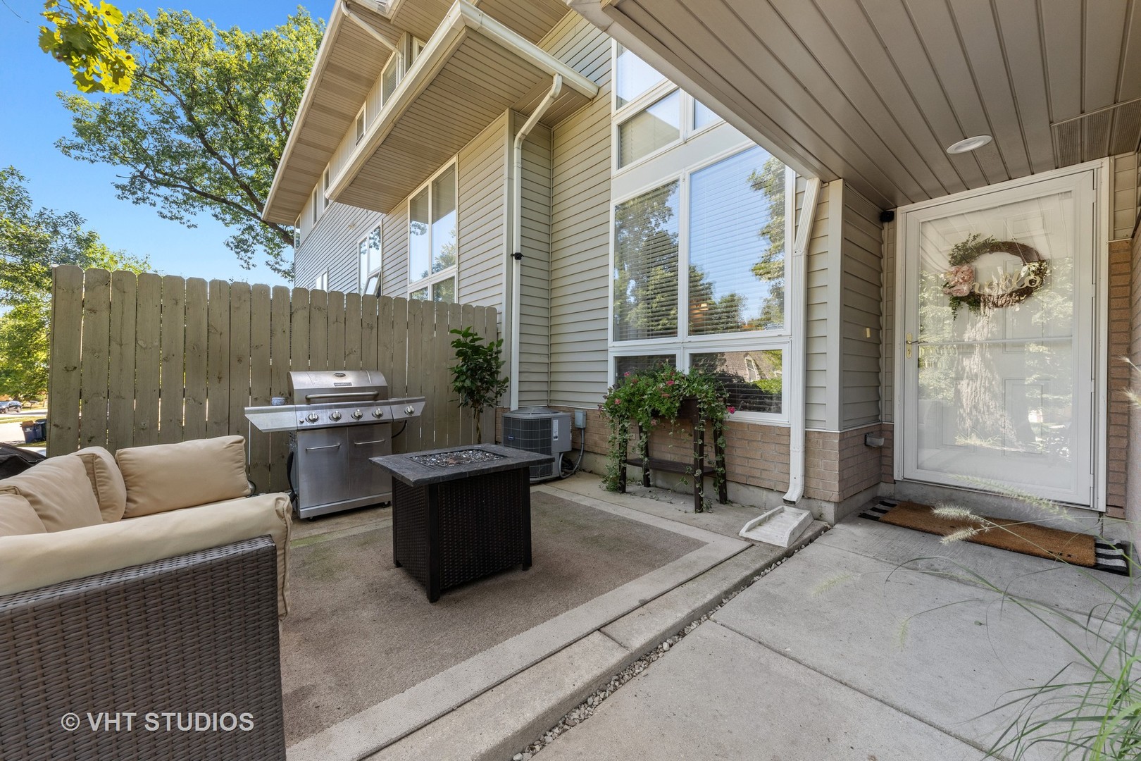 471 River Bend Road, Unit 103 Naperville, IL 60540 - Photo 20 of 29 a view of a patio with couches and chairs
