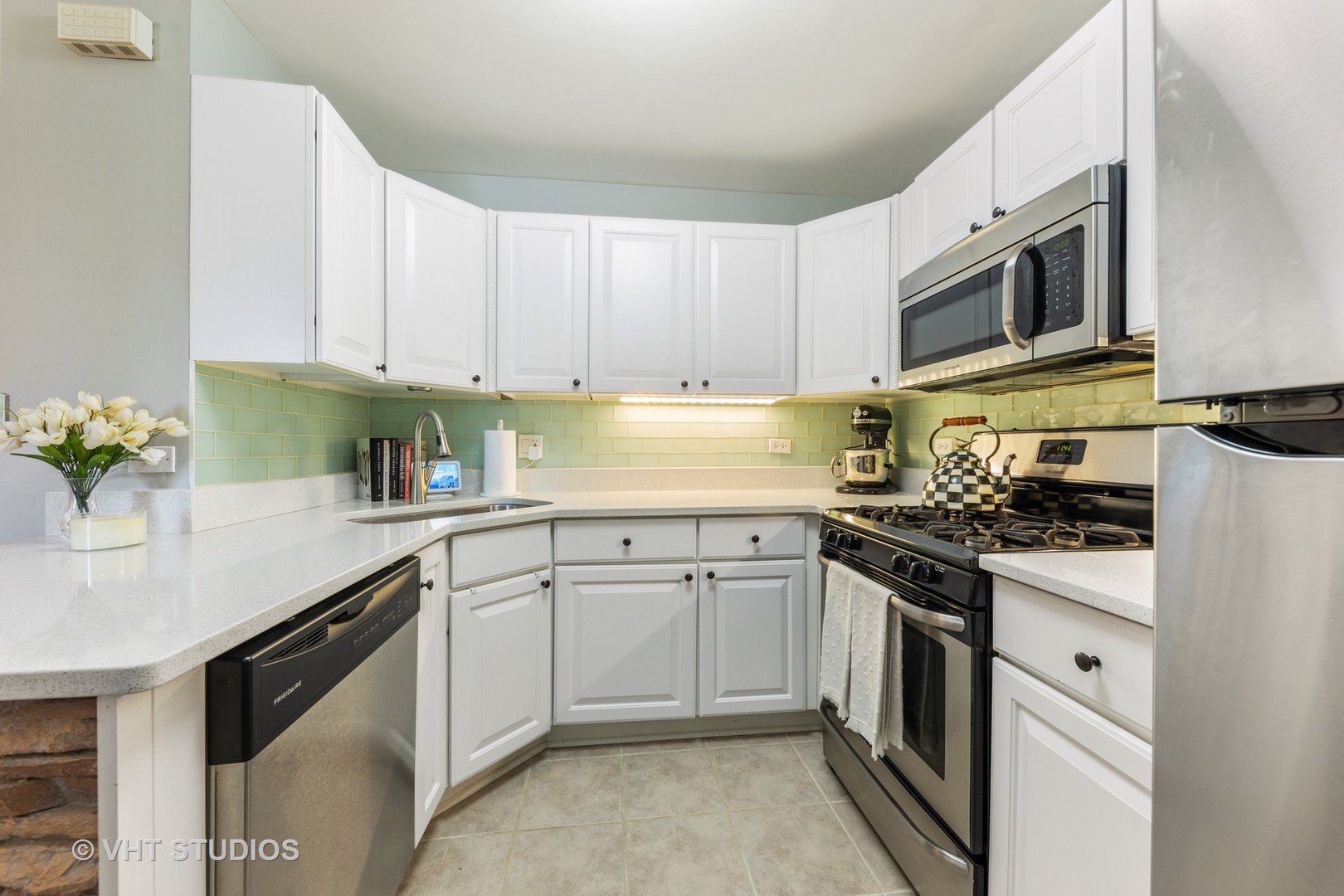 471 River Bend Road, Unit 103 Naperville, IL 60540 - Photo 6 of 29 a kitchen with stainless steel appliances granite countertop a sink stove and microwave