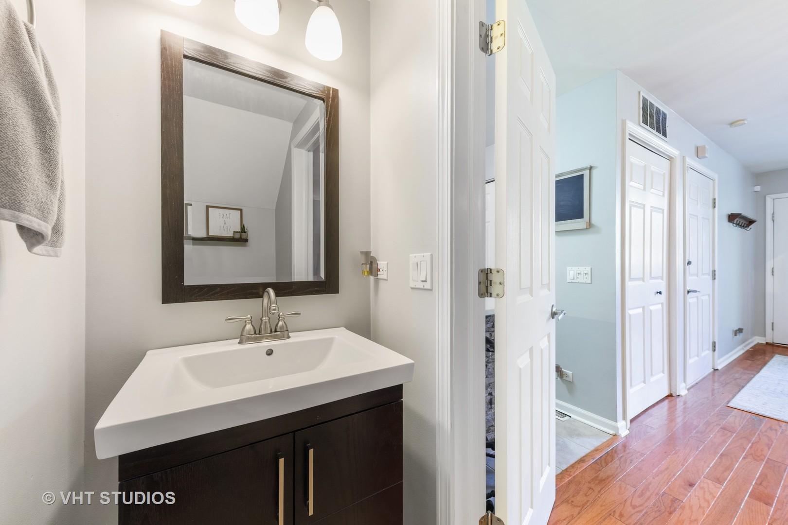 471 River Bend Road, Unit 103 Naperville, IL 60540 - Photo 8 of 29 a bathroom with a sink vanity and a mirror
