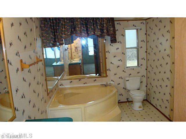 646 Simpson-Calhoun Road Greensboro, NC 27455 - Photo 8 of 11 Master Bath/Spa. Huge Garden tub and separate shower in the master bath.