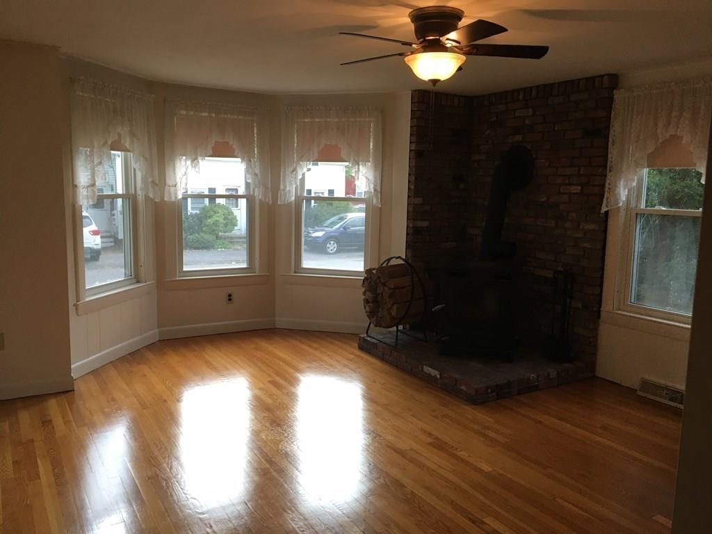21 Whitman Street Leominster, MA 01453 - Photo 18 of 35 a view of an empty room with wooden floor and a window