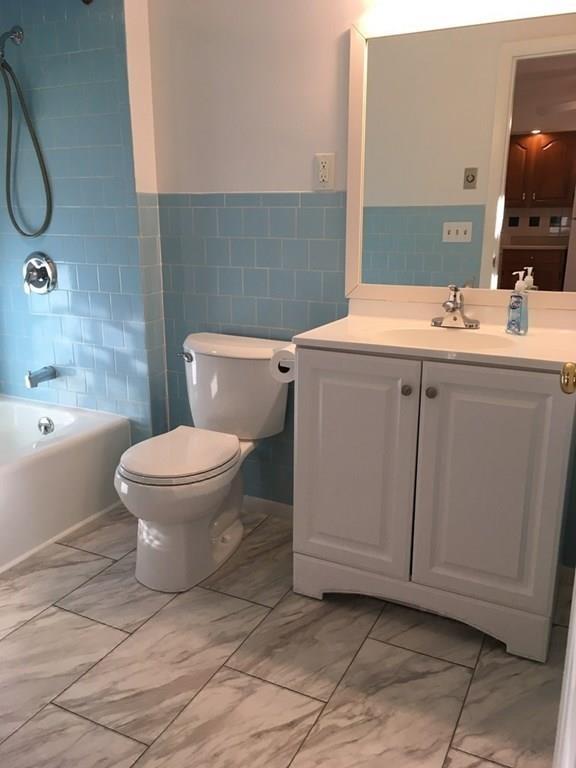 21 Whitman Street Leominster, MA 01453 - Photo 30 of 35 a bathroom with a sink toilet and shower