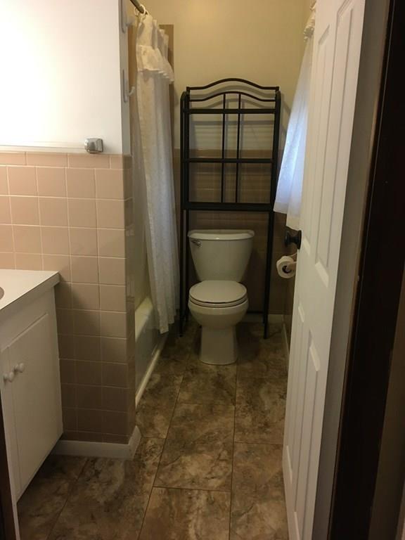 21 Whitman Street Leominster, MA 01453 - Photo 31 of 35 a bathroom with a toilet and a shower