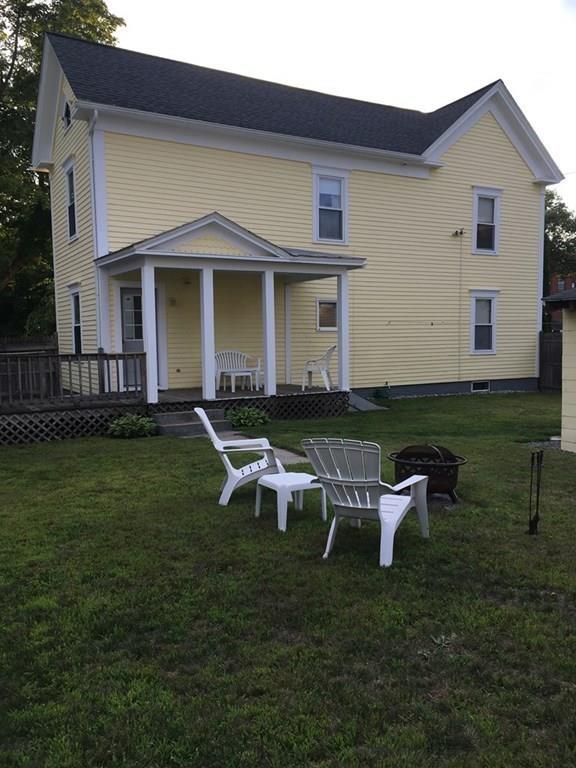 21 Whitman Street Leominster, MA 01453 - Photo 7 of 35 a view of a house with backyard sitting area and garden