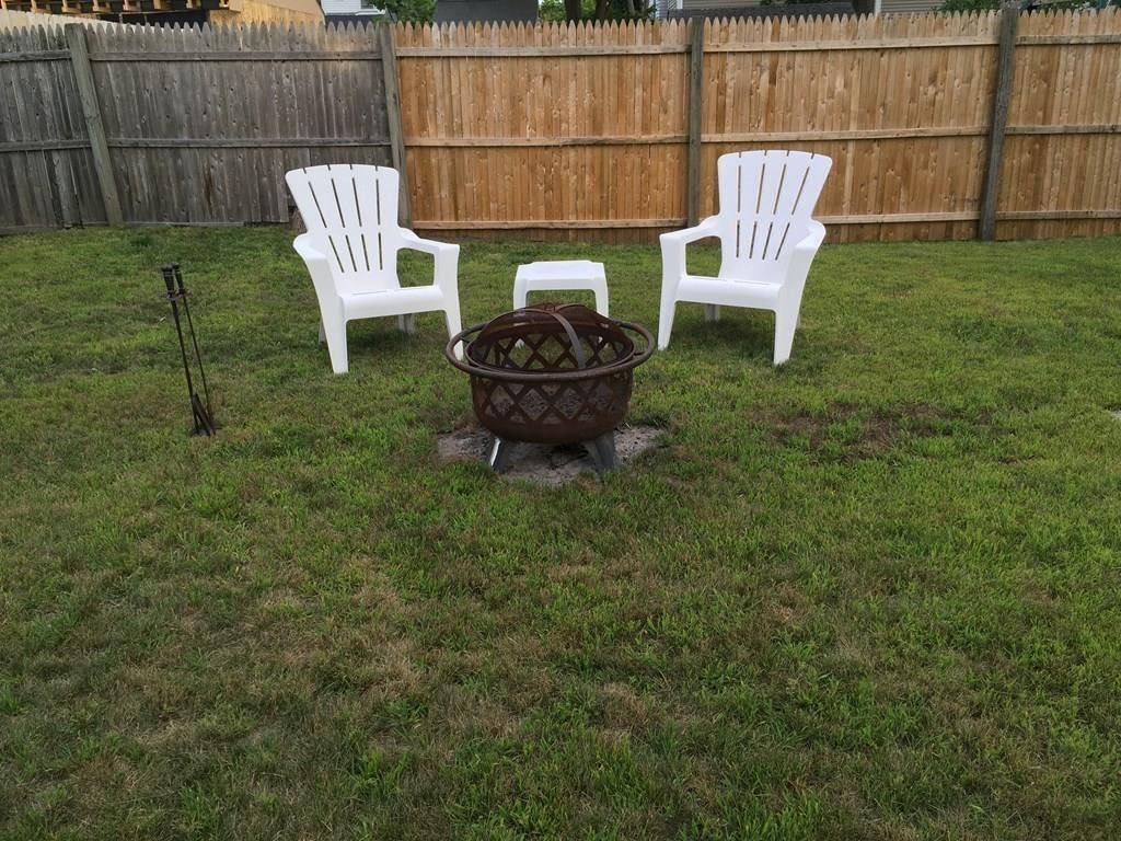 21 Whitman Street Leominster, MA 01453 - Photo 9 of 35 a view of a backyard with table and chairs
