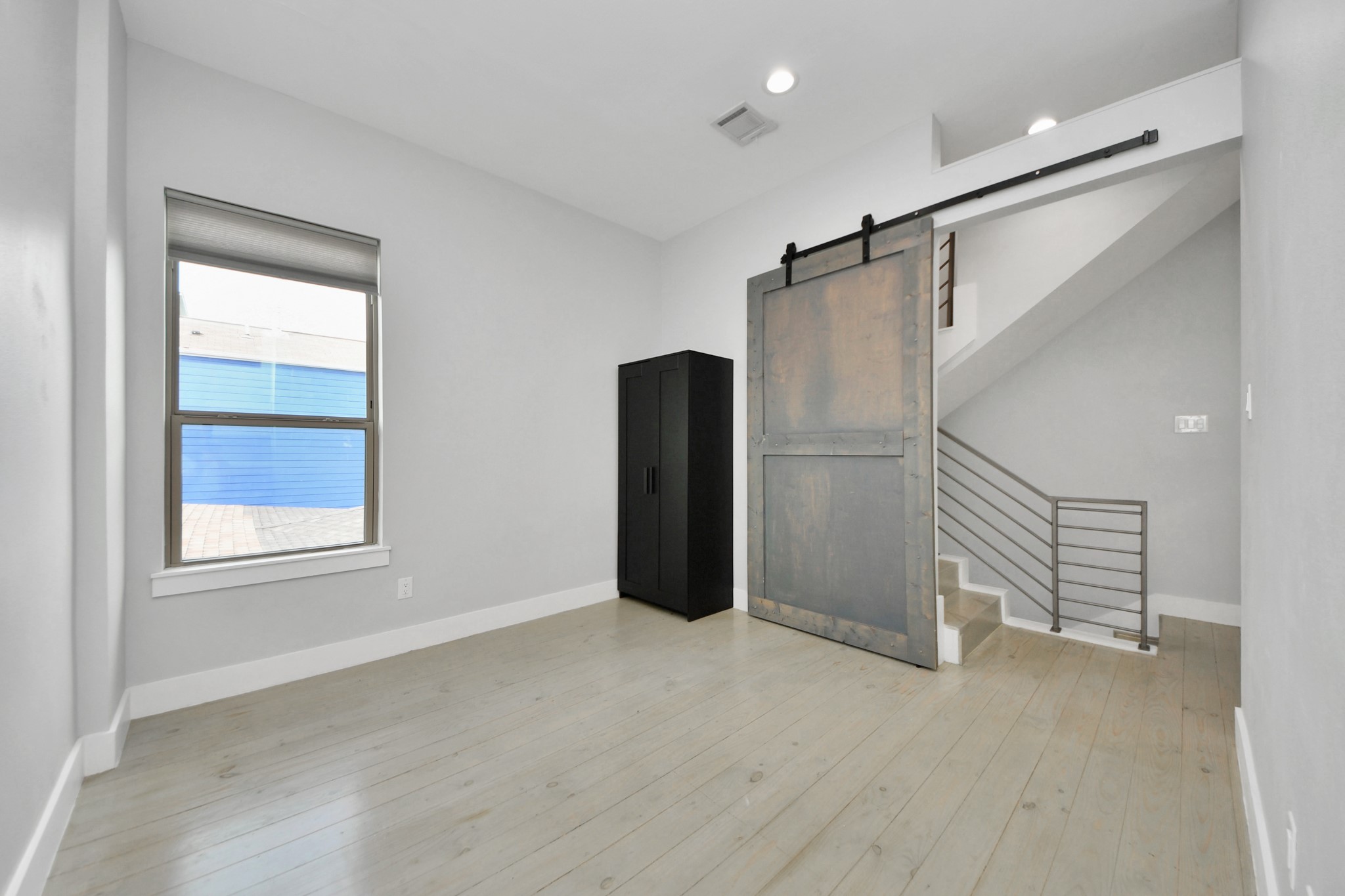 1708 Winter Street, Unit C Houston, TX 77007 - Photo 12 of 36 an empty room with windows and closet