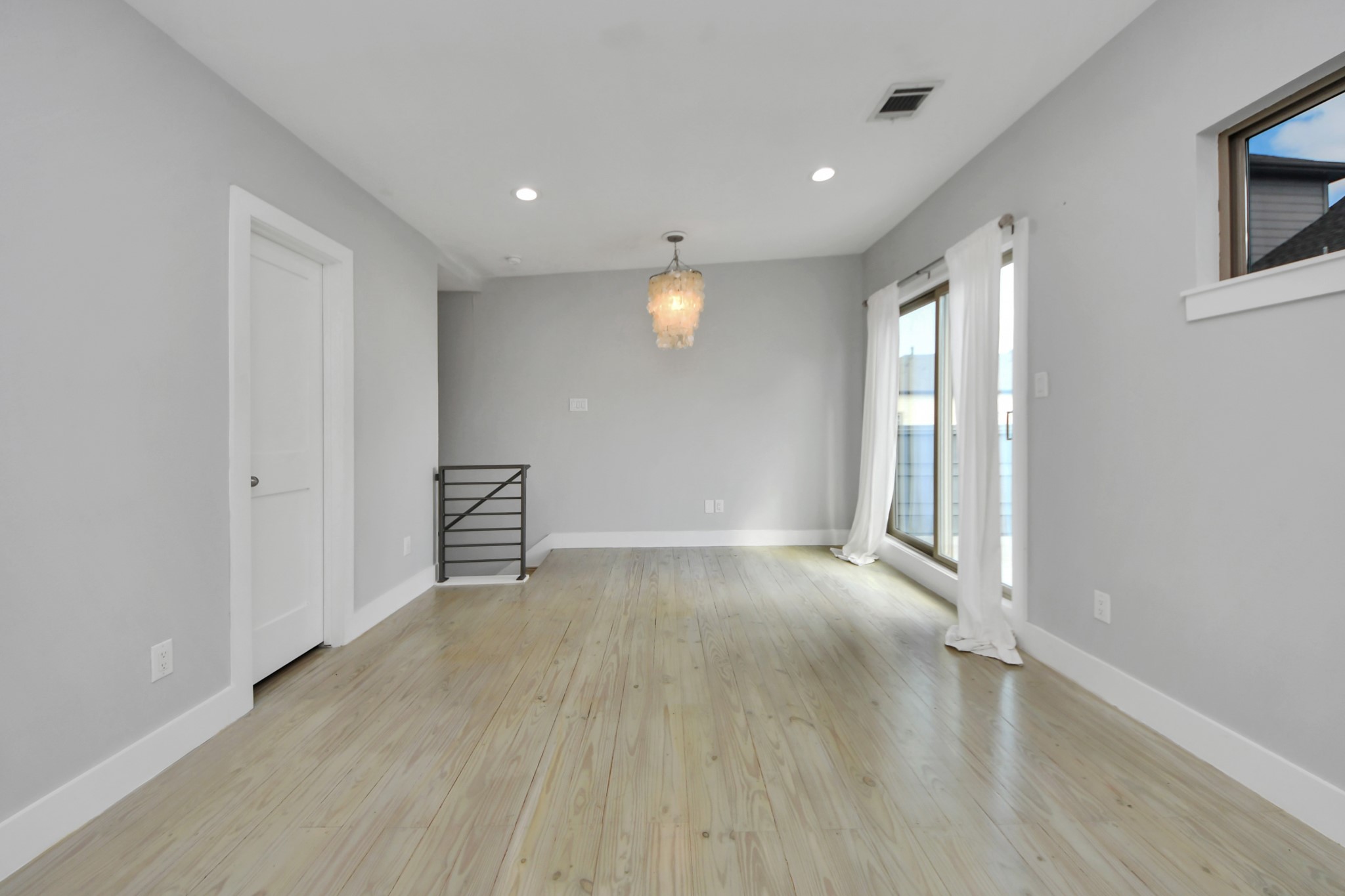 1708 Winter Street, Unit C Houston, TX 77007 - Photo 25 of 36 a view of an empty room with wooden floor and a window