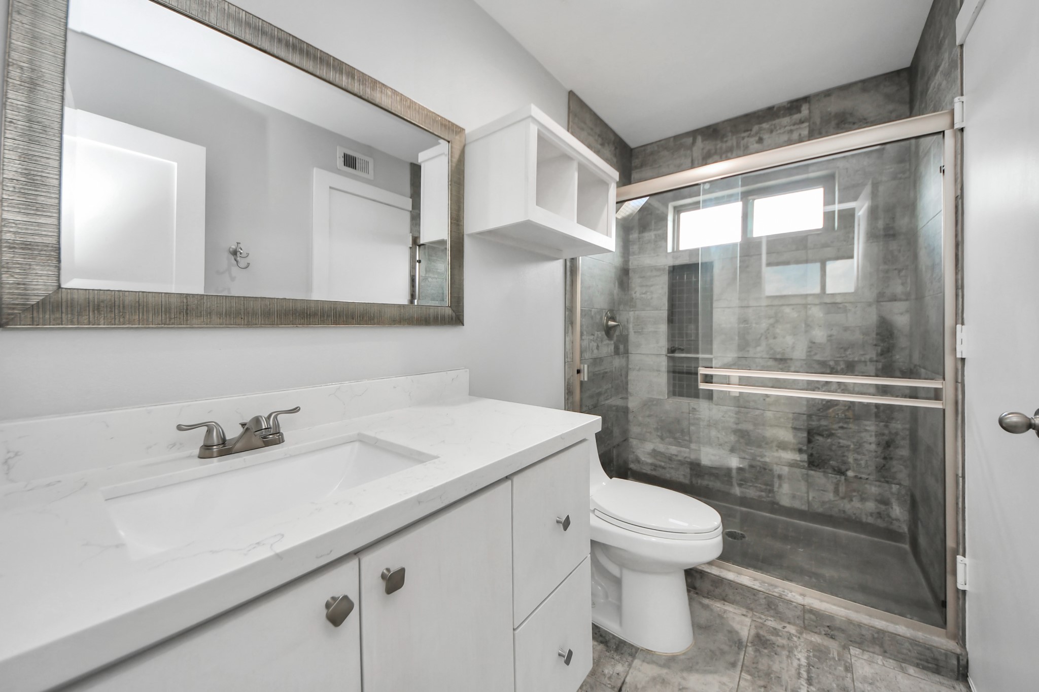 1708 Winter Street, Unit C Houston, TX 77007 - Photo 28 of 36 a bathroom with a sink toilet and shower