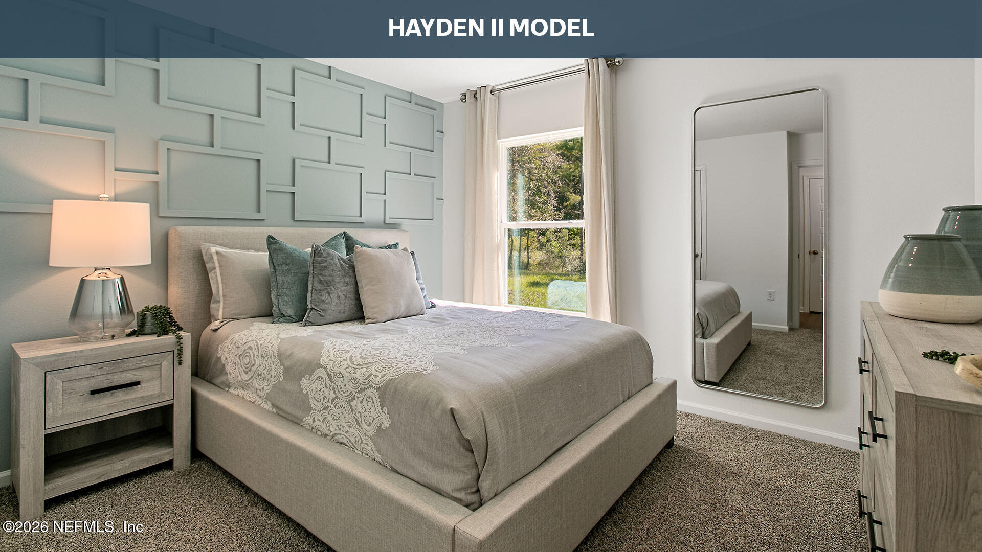 12433 Great Eagle Road Jacksonville, FL 32219 - Photo 15 of 70 a large bed sitting in a bedroom next to a window