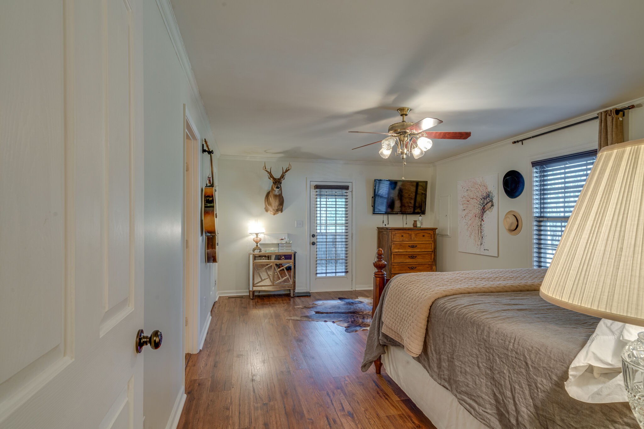 4867 Joe Peay Road Spring Hill, TN 37174 - Photo 20 of 43 a bed room with a bed and a chandelier