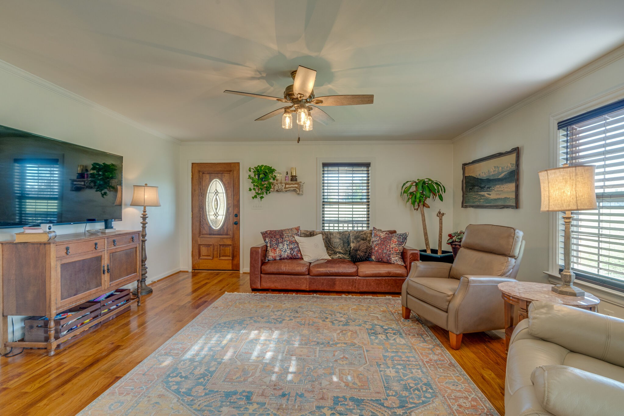 4867 Joe Peay Road Spring Hill, TN 37174 - Photo 8 of 43 a living room with furniture and a flat screen tv