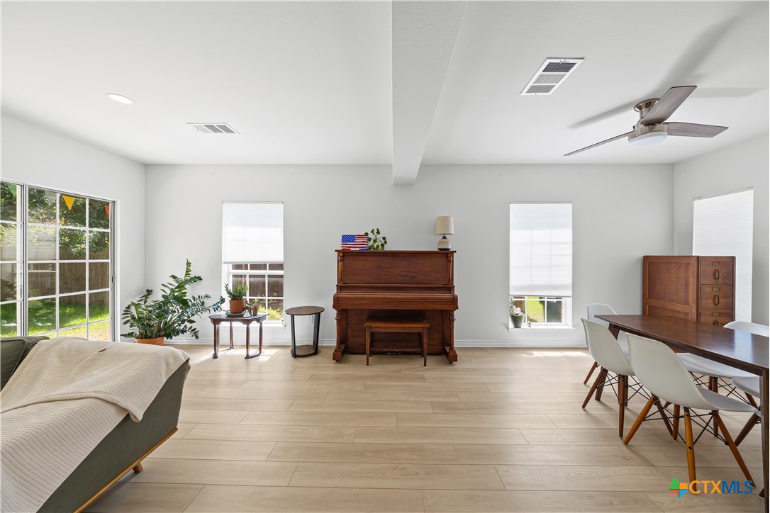 1710 Greening Way Leander, TX 78641 - Photo 11 of 47 a living room with furniture and a flat screen tv