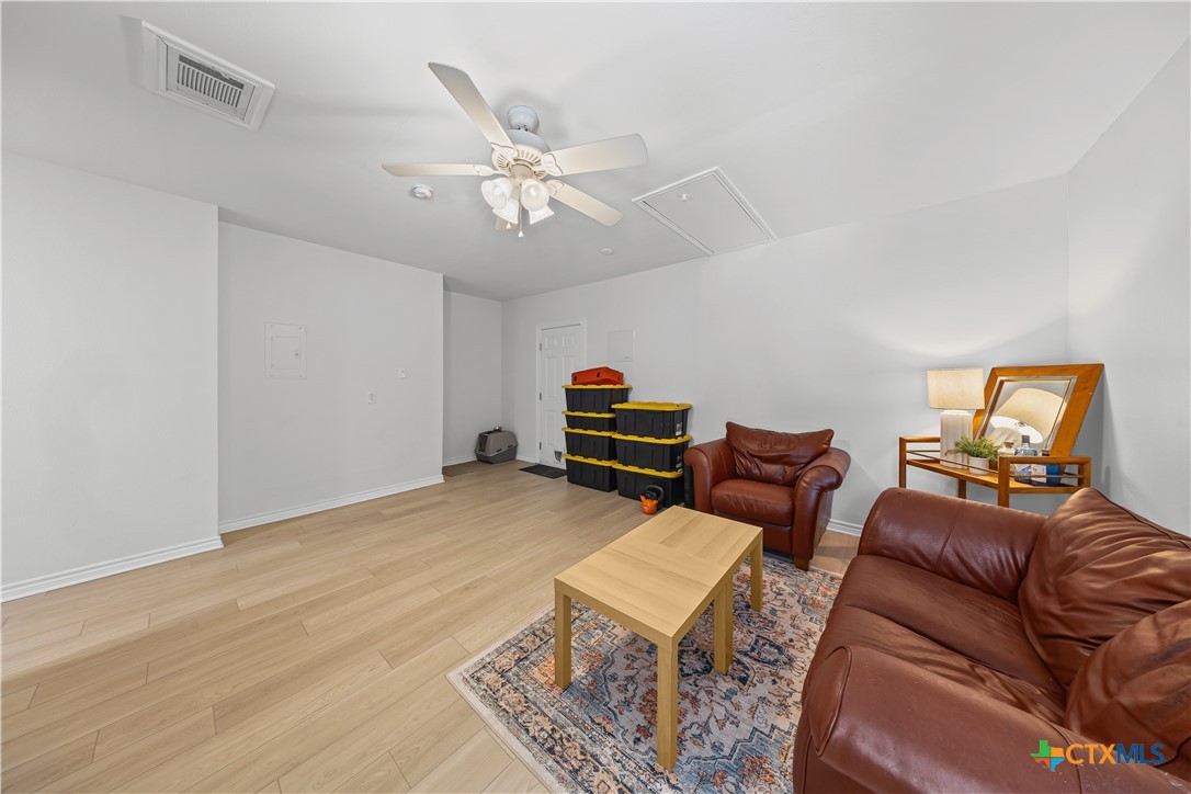 1710 Greening Way Leander, TX 78641 - Photo 18 of 47 a living room with furniture and a wooden floor