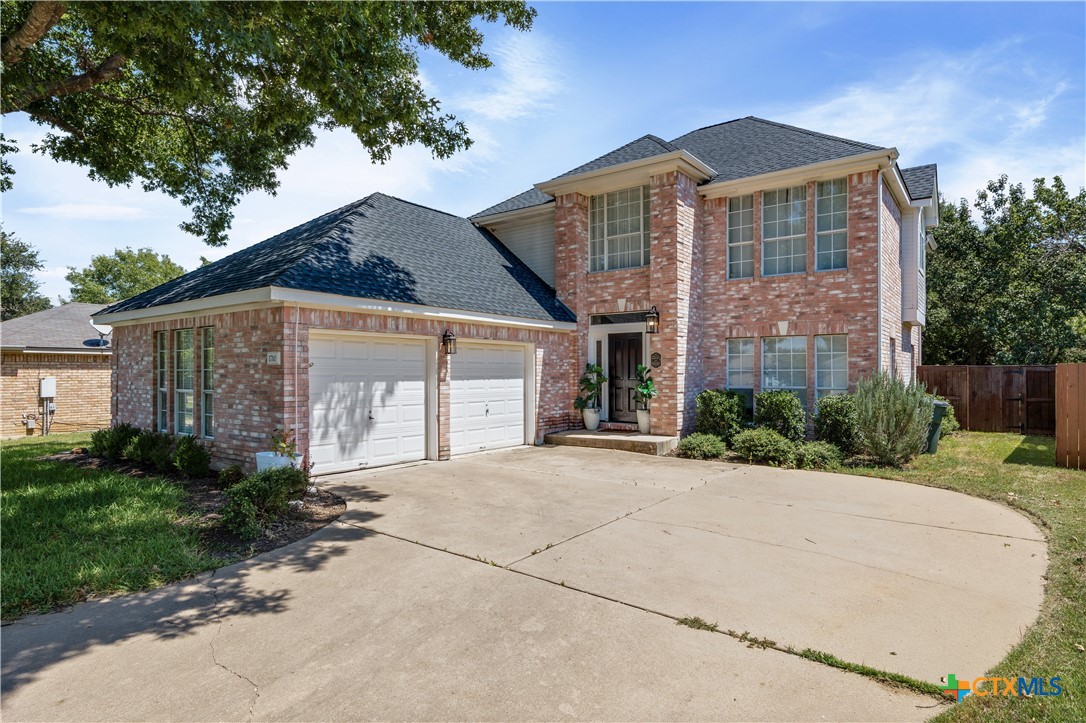 1710 Greening Way Leander, TX 78641 - Photo 2 of 47 a front view of a house with a garden