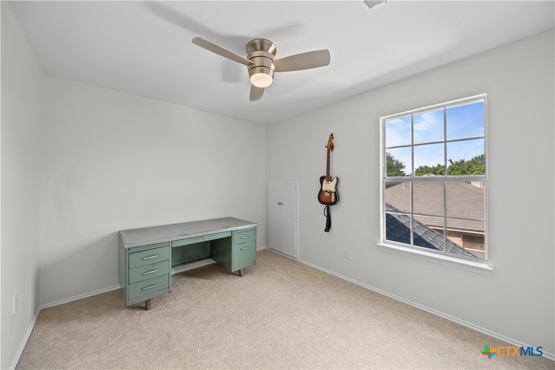 1710 Greening Way Leander, TX 78641 - Photo 23 of 47 a view of room with window and ceiling fan