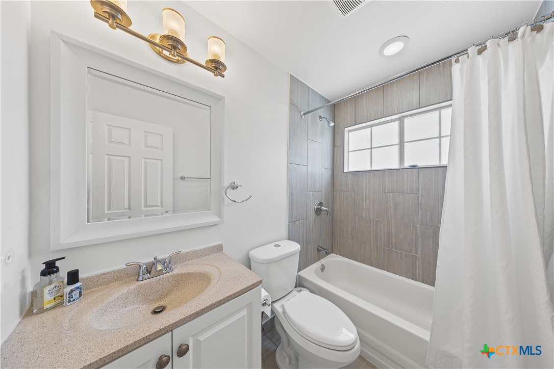 1710 Greening Way Leander, TX 78641 - Photo 25 of 47 a bathroom with a sink a toilet and shower