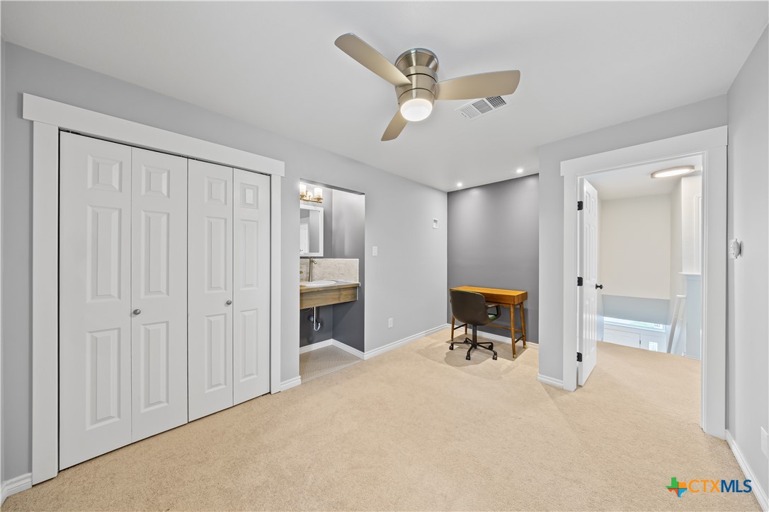 1710 Greening Way Leander, TX 78641 - Photo 27 of 47 a view of a livingroom with a furniture and a ceiling fan