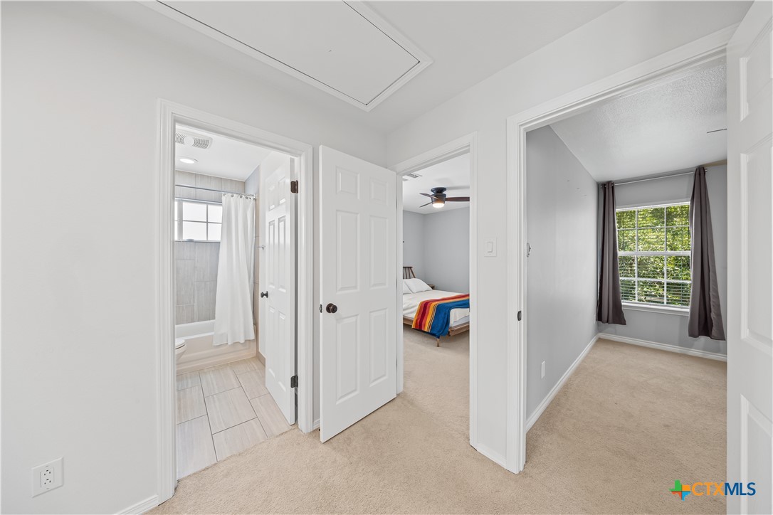 1710 Greening Way Leander, TX 78641 - Photo 29 of 47 a view of a bathroom with a tub and shower