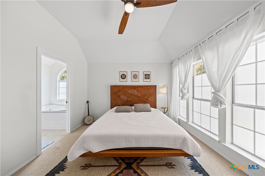 1710 Greening Way Leander, TX 78641 - Photo 30 of 47 a bedroom with a bed and a window with outer view